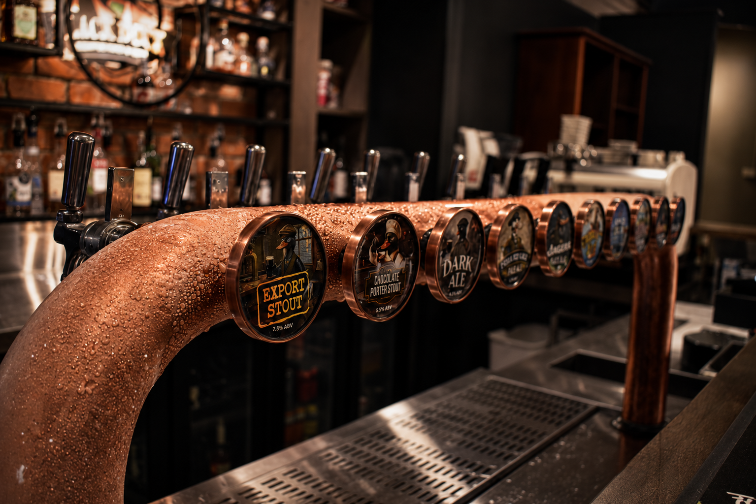 Copper beer tap line-up with Export Stout, Chocolate Porter Stout and Dark Ale badges